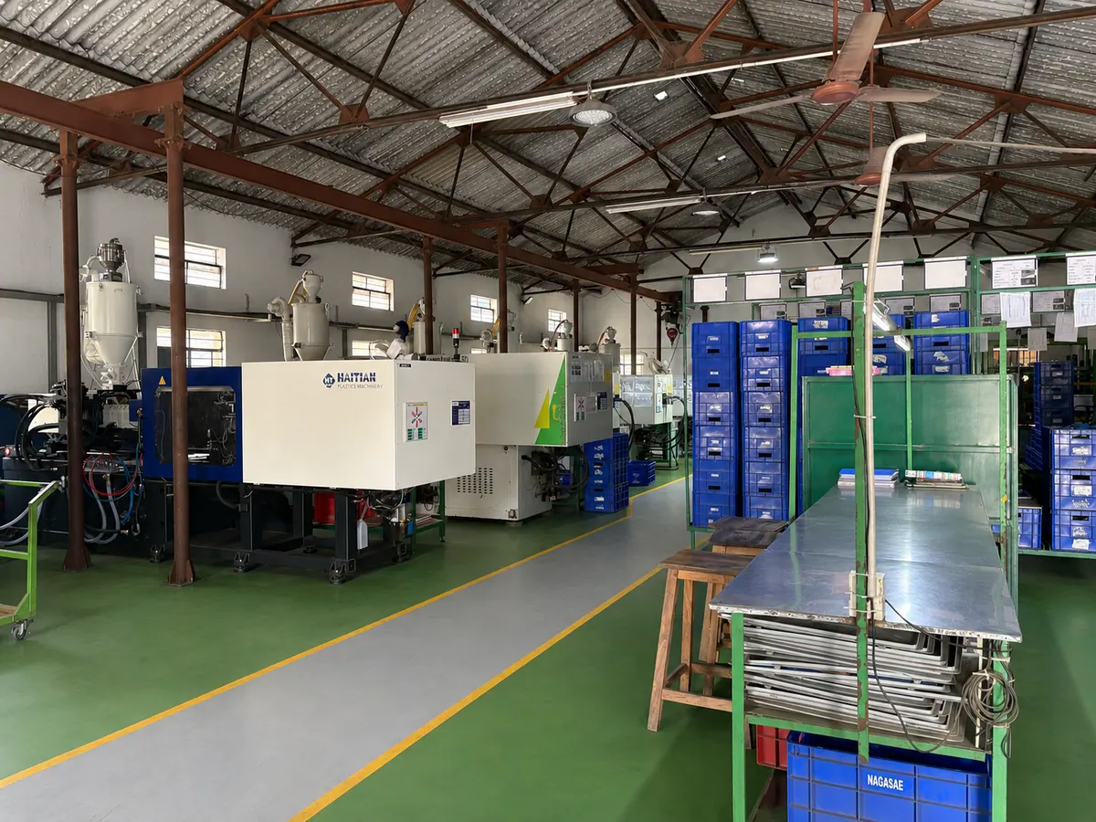 Nagasae factory floor with plastic injection moulding machines and organized production lanes